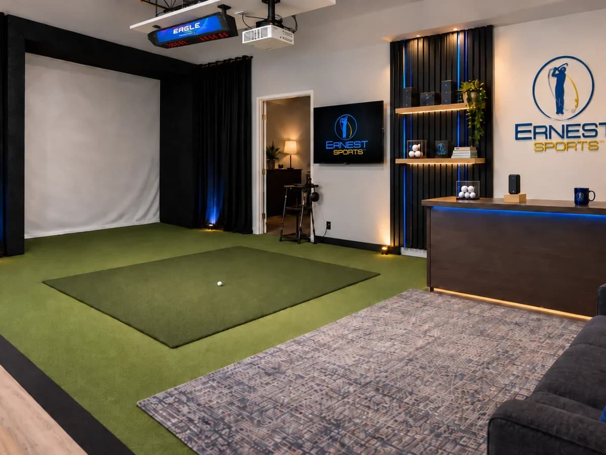 E6 Connect running in the Ernest Sports studio simulator bay, with the Eagle Sim mounted overhead